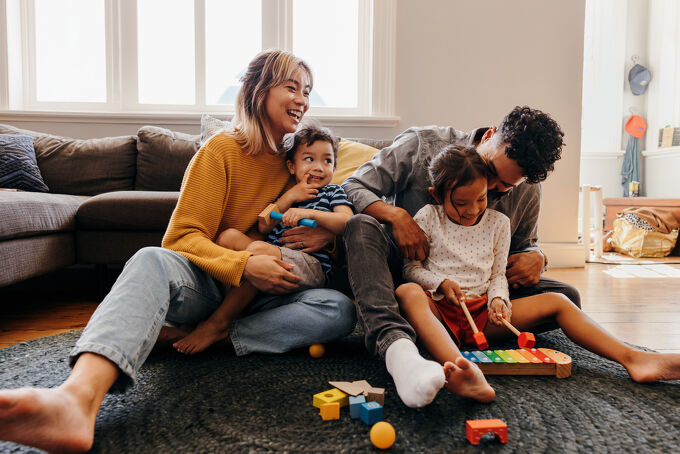 Rent with us Happy family in living room
